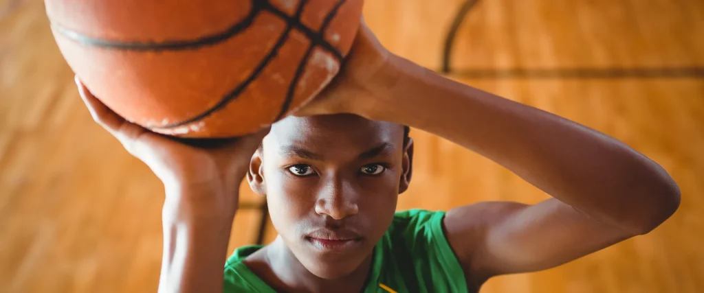 closeup shooting a basket
